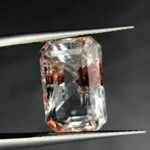 natural rock crystal with spessartine garnet inclusions.